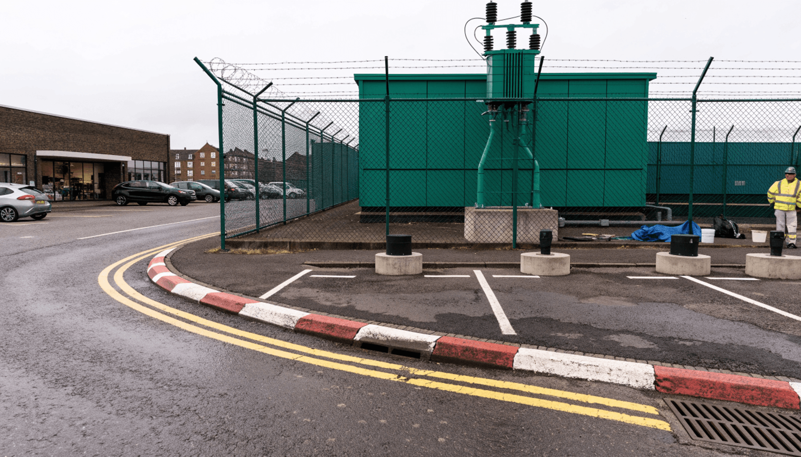 Electricity substation beside a UK commercial car park where EV chargers are being installed